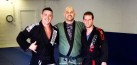 Victor, Cpt. Aaron and Jesse pose on the new mats.